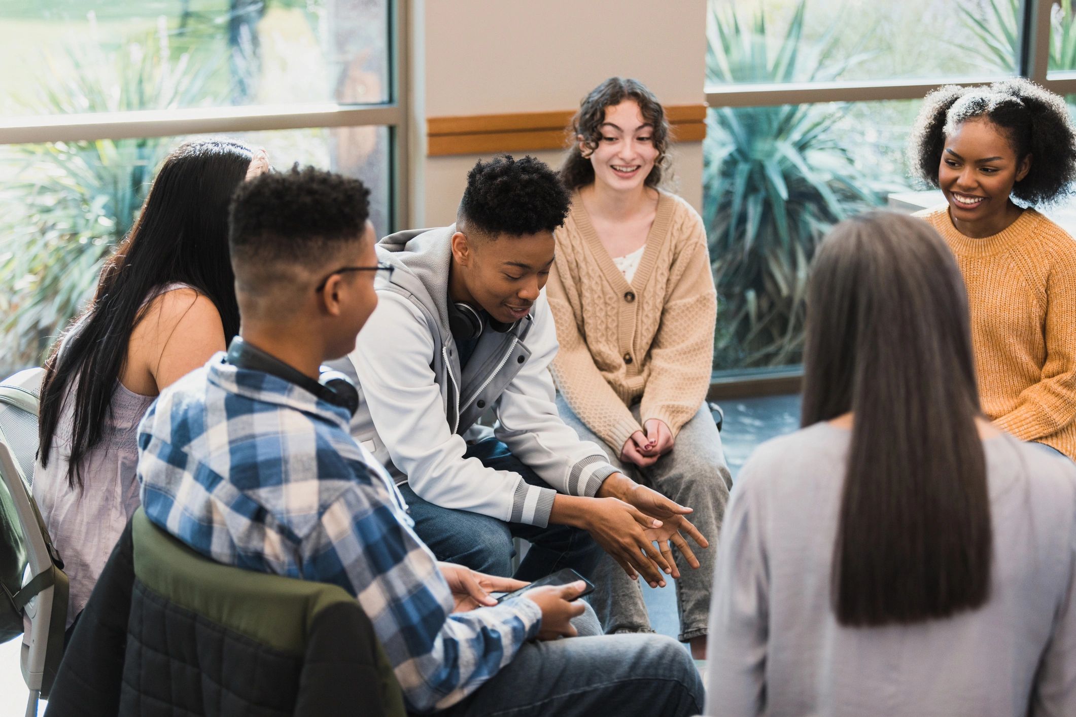 Small group conversation in a warm, supportive setting