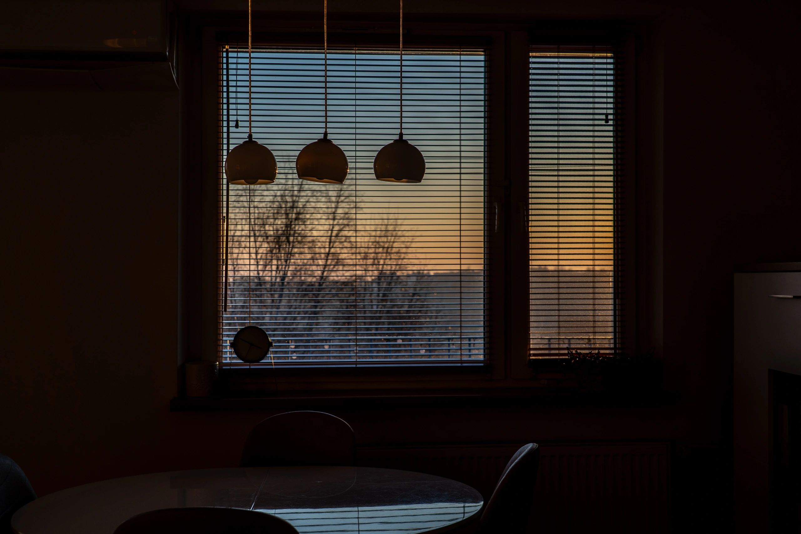 Warm light through window blinds, calming atmosphere
